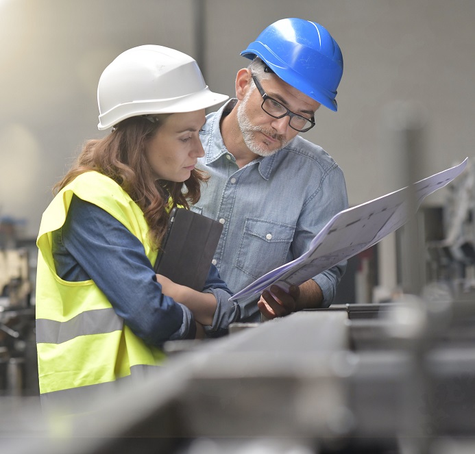 Metal industry manager and engineer meeting in factory
